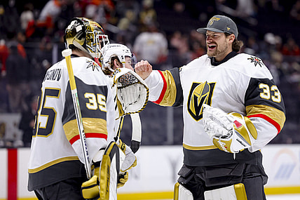 Vegas Golden Knights goaltender Ilya Samsonov, left, celebrates with goaltender Adin Hill after the team's win against the Anaheim Ducks during an NHL hockey game Wednesday, Dec. 4, 2024, in Anaheim, Calif. (AP Photo/Ryan Sun)