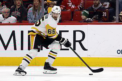 Pittsburgh Penguins' Erik Karlsson (65) moves the puck against the Carolina Hurricanes during the second period of an NHL hockey game in Raleigh, N.C., Sunday, Jan. 5, 2025. (AP Photo/Karl DeBlaker)