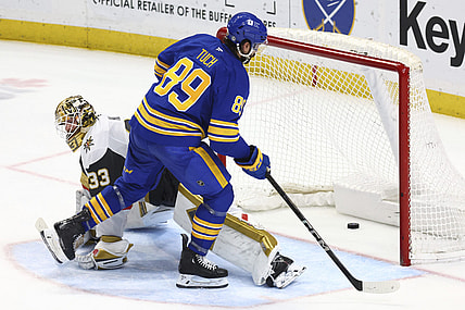 Buffalo Sabres right wing Alex Tuch (89) puts the puck past Vegas Golden Knights goaltender Adin Hill (33) for the game winning goal during a shootout in an NHL hockey game Saturday, March 15, 2025, in Buffalo, N.Y. (AP Photo/Jeffrey T. Barnes)