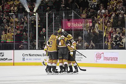 Vegas Golden Knights celebrate after Vegas Golden Knights defenseman Noah Hanifin scored against the Nashville Predators during the third period of an NHL hockey game Saturday, April 12, 2025, in Las Vegas. (AP Photo/John Locher)