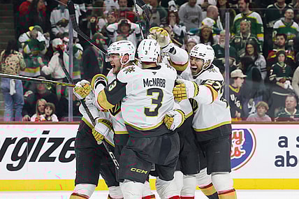 Vegas Golden Knights center Ivan Barbashev (49) celebrates with teammates after scoring a goal the winning goal during overtime in Game 4 of an NHL hockey Stanley Cup first-round playoff series against the Minnesota Wild, Saturday, April 26, 2025, in St. Paul, Minn. (AP Photo/Stacy Bengs)