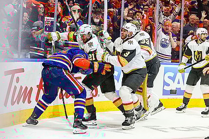 EDMONTON, AB - MAY 12: Las Vegas Golden Knights Center Brett Howden (21) and Las Vegas Golden Knights Goalie Aden Hill (33) attack Edmonton Oilers Right Wing Evander Kane (91) in the first period of the Stanley Cup Playoffs Second Round Edmonton Oilers game versus the Las Vegas Golden Knights on May 12, 2025 at Rogers Place in Edmonton, AB. (Photo by Curtis Comeau/Icon Sportswear)