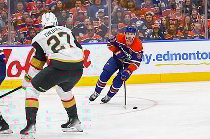 EDMONTON, AB - MAY 12: Las Vegas Golden Knights Defenceman Shea Theodore (27) stops Edmonton Oilers Center Connor McDavid (97) in the first period of the Stanley Cup Playoffs Second Round Edmonton Oilers game versus the Las Vegas Golden Knights on May 12, 2025 at Rogers Place in Edmonton, AB. (Photo by Curtis Comeau/Icon Sportswear)