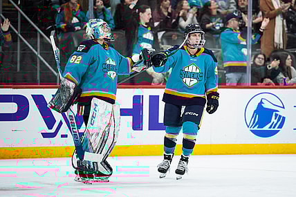 New York Sirens forward Kristyna Kaltounkova fist bumps goalie Kayle Osborne