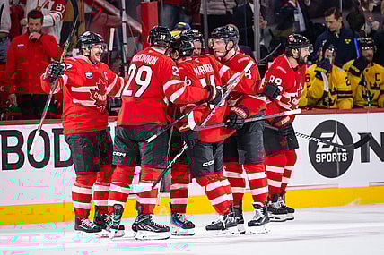 Mitch Marner (16) of Team Canada celebrates with teammates after scoring a goal during the (OT) period of the 4 Nations Face-Off game between Canada and Sweden on February 12, 2025, at Bell Centre in Montreal, Quebec