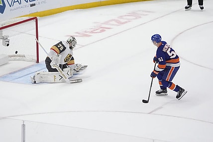 ELMONT, NY - DECEMBER 09: New York Islanders Left Wing Emil Heineman (51) scores the winning goal against Vegas Golden Knights Goalie Carter Hart (79) during the shootout of the National Hockey League game between the Vegas Golden Knights and the New York Islanders on December 9, 2025, at UBS Arena in Elmont, NY. (Photo by Gregory Fisher/Icon Sportswire)