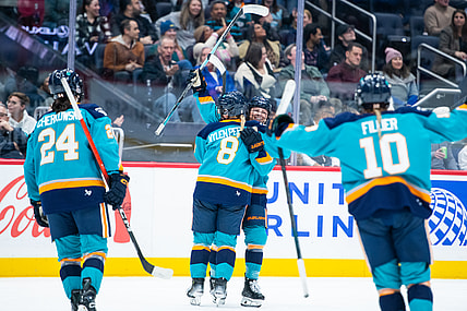 New York Sirens forwards Sarah Fillier, Paetyn Levis, and Anne Cherkowski celebrate with Maja Nylen Persson during a 2-1 win over the Montreal Victoire.