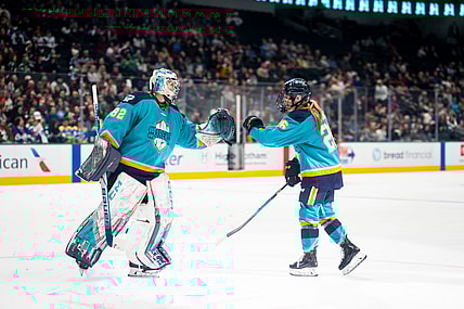 New York Sirens goalie Kayle Osborne and rookie forward Casey O'Brien fist bump after a comeback win over the Seattle Torrent.