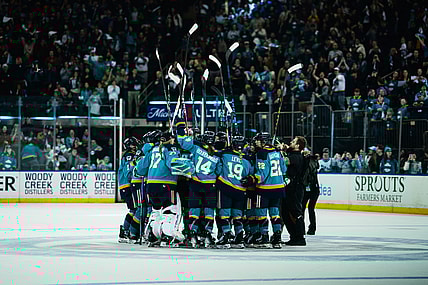The New York Sirens huddle at center ice to celebrate a 2-1 shootout win over the Seattle Torrent at Madison Square Garden.
