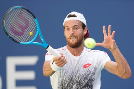Sept 3, 2018; New York, NY, USA;  Joao Sousa of Portugal hits to Novak Djokovic of Serbia in a fourth round match on day eight of the 2018 U.S. Open tennis tournament at USTA Billie Jean King National Tennis Center. Mandatory Credit: Robert Deutsch-USA TODAY Sports