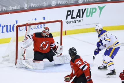 Feb 20, 2021; Newark, New Jersey, USA; Buffalo Sabres center Sam Reinhart (23) shoots the puck past New Jersey Devils goaltender Mackenzie Blackwood (29) for a goal during the second period at Prudential Center. Mandatory Credit: Vincent Carchietta-USA TODAY Sports