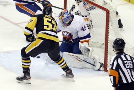 Mar 29, 2021; Pittsburgh, Pennsylvania, USA; Pittsburgh Penguins right wing Anthony Angello (57) scores a goal against New York Islanders goaltender Semyon Varlamov (40) during the first period at PPG Paints Arena. Mandatory Credit: Charles LeClaire-USA TODAY Sports
