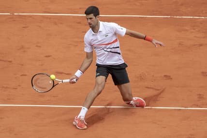 Jun 8, 2019; Paris, France; Novak Djokovic (SRB) in action during his match against Dominic Thiem (AUT) on day 14 of the 2019 French Open at Stade Roland Garros. Mandatory Credit: Susan Mullane-USA TODAY Sports