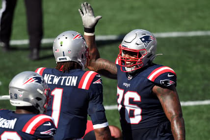Sep 13, 2020; Foxborough, Massachusetts, USA; New England Patriots quarterback Cam Newton (1) celebrates with offensive tackle Isaiah Wynn (76) after scoring a touchdown against the Miami Dolphins during the third quarter at Gillette Stadium. Mandatory Credit: Brian Fluharty-USA TODAY Sports