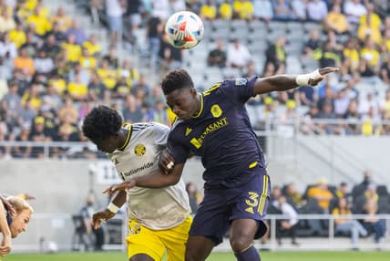Jul 21, 2021; Columbus, Ohio, USA; Nashville SC defender Jalil Anibaba (3) heads the ball while Columbus Crew defender Aboubacar Keita (30) defends in the first half at Lower.com Stadium. Mandatory Credit: Trevor Ruszkowski-USA TODAY Sports