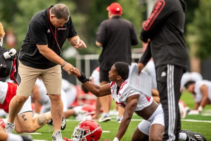 Rutgers football's first practice of training camp is held In Piscataway on Wednesday August 4, 2021. Head coach Greg Schiano shakes a player's hand during practice.

Rutgers Football Training Camp Practice