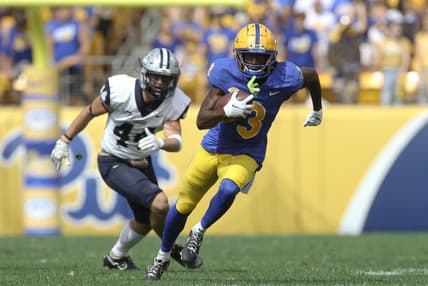 Sep 25, 2021; Pittsburgh, Pennsylvania, USA;  Pittsburgh Panthers wide receiver Jordan Addison (3) runs after a catch on his way to scoring a touchdown as New Hampshire Wildcats defensive back Noah Palm (44) chases during the second quarter at Heinz Field. Mandatory Credit: Charles LeClaire-USA TODAY Sports