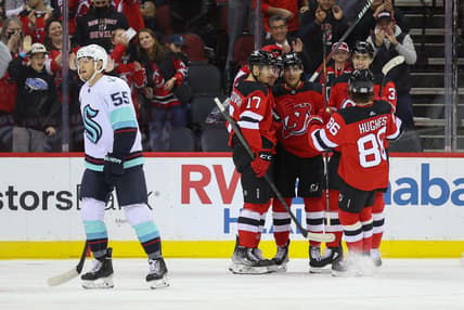 Oct 19, 2021; Newark, New Jersey, USA; The New Jersey Devils celebrate a goal by defenseman Damon Severson (28) during the first period of their game against the Seattle Kraken at Prudential Center. Mandatory Credit: Ed Mulholland-USA TODAY Sports