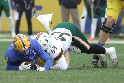 Oct 30, 2021; Pittsburgh, Pennsylvania, USA; Miami Hurricanes defensive lineman Zach McCloud (53) sacks Pittsburgh Panthers quarterback Kenny Pickett (8) during the first quarter at Heinz Field. Mandatory Credit: Charles LeClaire-USA TODAY Sports