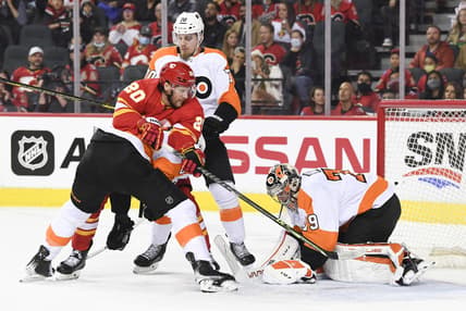 Oct 30, 2021; Calgary, Alberta, CAN; Philadelphia Flyers goalie Carter Hart (79) stops a shot against Calgary Flames forward Blake Coleman (20) during the first period at Scotiabank Saddledome. Mandatory Credit: Candice Ward-USA TODAY Sports