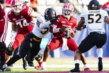Dec 4, 2021; Lafayette, LA, USA; Appalachian State Mountaineers offensive linebacker Nick Hampton (31) sacks Louisiana Ragin' Cajuns quarterback Levi Lewis (1) during the first quarter of the Sun Belt Conference championship game. Mandatory Credit: Andrew Wevers-USA TODAY Sports