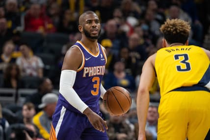 Jan 14, 2022; Indianapolis, Indiana, USA; Phoenix Suns guard Chris Paul (3) dribbles the ball while Indiana Pacers guard Chris Duarte (3) defends in the second half at Gainbridge Fieldhouse. Mandatory Credit: Trevor Ruszkowski-USA TODAY Sports
