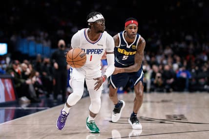Jan 19, 2022; Denver, Colorado, USA; Los Angeles Clippers guard Reggie Jackson (1) controls the ball ahead of Denver Nuggets forward Will Barton (5) in the first quarter at Ball Arena. Mandatory Credit: Isaiah J. Downing-USA TODAY Sports