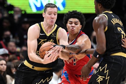 Nov 13, 2021; Toronto, Ontario, CAN; Toronto Raptors guard Goran Dragic (1) battles for the ball with Detroit Pistons guard Killian Hayes (7) in the first half at Scotiabank Arena. Mandatory Credit: Dan Hamilton-USA TODAY Sports