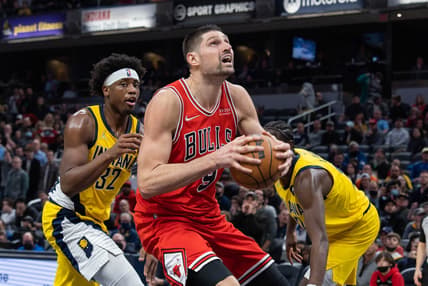 Feb 4, 2022; Indianapolis, Indiana, USA; Chicago Bulls center Nikola Vucevic (9) moves to shoot the ball while Indiana Pacers guard Terry Taylor (32) defends in the second half at Gainbridge Fieldhouse. Mandatory Credit: Trevor Ruszkowski-USA TODAY Sports