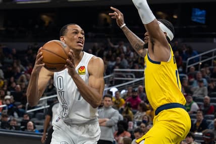 Feb 25, 2022; Indianapolis, Indiana, USA; Oklahoma City Thunder forward Darius Bazley (7) shoots the ball while Indiana Pacers forward Oshae Brissett (12) defends  in the first half at Gainbridge Fieldhouse. Mandatory Credit: Trevor Ruszkowski-USA TODAY Sports