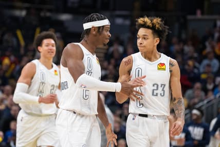 Feb 25, 2022; Indianapolis, Indiana, USA; Oklahoma City Thunder guard Shai Gilgeous-Alexander (2) and guard Tre Mann (23) celebrate during a timeout in the second half against the Indiana Pacers  at Gainbridge Fieldhouse. Mandatory Credit: Trevor Ruszkowski-USA TODAY Sports