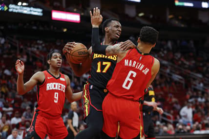 Apr 10, 2022; Houston, Texas, USA; Atlanta Hawks forward Onyeka Okongwu (17) attempts to secure the ball away from Houston Rockets forward Kenyon Martin Jr. (6) during the second quarter at Toyota Center. Mandatory Credit: Troy Taormina-USA TODAY Sports