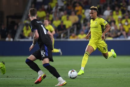 May 18, 2022; Nashville, Tennessee, USA; Nashville SC midfielder Hany Mukhtar (10) handles the ball into the offensive zone during the first half against the CF Montreal at GEODIS Park. Mandatory Credit: Christopher Hanewinckel-USA TODAY Sports