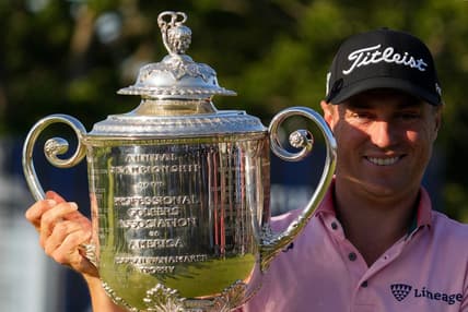 May 22, 2022; Tulsa, Oklahoma, USA; Justin Thomas holds the Wanamaker Trophy after winning the PGA Championship golf tournament in a three hole playoff. Mandatory Credit: Michael Madrid-USA TODAY Sports