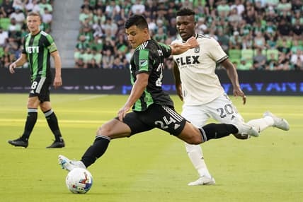 Aug 26, 2022; Austin, Texas, USA; Austin FC defender Nick Lima (24) passes in front of Los Angeles FC midfielder Daniel Crisostomo (20) during the first half at Q2 Stadium. Mandatory Credit: Scott Wachter-USA TODAY Sports