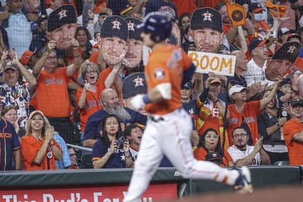 Sep 30, 2022; Houston, Texas, USA; Fans cheer and Houston Astros third baseman Alex Bregman (2) rounds the bases after hitting a home run during the first inning against the Tampa Bay Rays at Minute Maid Park. Mandatory Credit: Troy Taormina-USA TODAY Sports
