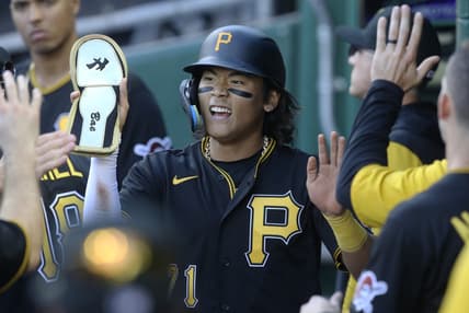 Oct 5, 2022; Pittsburgh, Pennsylvania, USA;  Pittsburgh Pirates center fielder Ji Hwan Bae (71) high-fives in the dugout after scoring a run against the St. Louis Cardinals during the third inning at PNC Park. Mandatory Credit: Charles LeClaire-USA TODAY Sports