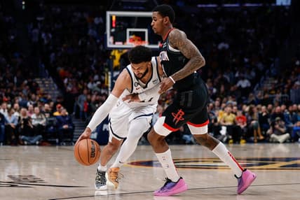 Nov 30, 2022; Denver, Colorado, USA; Denver Nuggets guard Jamal Murray (27) controls the ball under pressure from Houston Rockets guard Kevin Porter Jr. (3) in the second quarter at Ball Arena. Mandatory Credit: Isaiah J. Downing-USA TODAY Sports