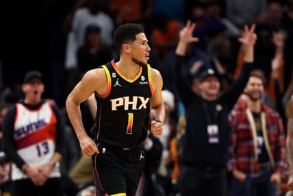 Dec 17, 2022; Phoenix, Arizona, USA; Phoenix Suns guard Devin Booker (1) against the New Orleans Pelicans at Footprint Center. Mandatory Credit: Mark J. Rebilas-USA TODAY Sports
