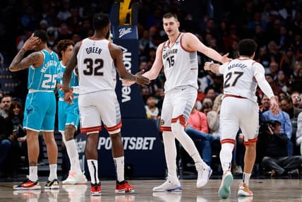 Dec 18, 2022; Denver, Colorado, USA; Denver Nuggets center Nikola Jokic (15) reacts with forward Jeff Green (32) and guard Jamal Murray (27) in the second quarter against the Charlotte Hornets at Ball Arena. Mandatory Credit: Isaiah J. Downing-USA TODAY Sports