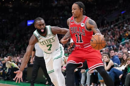 Jan 9, 2023; Boston, Massachusetts, USA; Chicago Bulls forward DeMar DeRozan (11) drives the ball against Boston Celtics guard Jaylen Brown (7) in the first quarter at TD Garden. Mandatory Credit: David Butler II-USA TODAY Sports