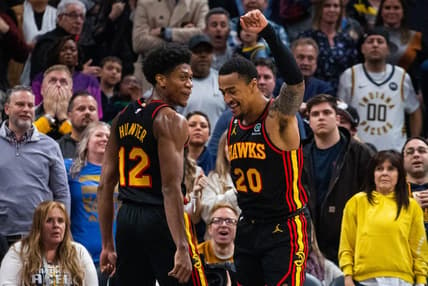 Jan 13, 2023; Indianapolis, Indiana, USA; Atlanta Hawks forward John Collins (20) celebrates his game-winning shot with forward De'Andre Hunter (12) in the second half against the Indiana Pacers at Gainbridge Fieldhouse. Mandatory Credit: Trevor Ruszkowski-USA TODAY Sports