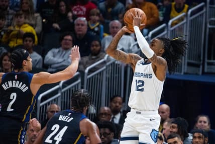 Jan 14, 2023; Indianapolis, Indiana, USA; Memphis Grizzlies guard Ja Morant (12)  shoots the ball while Indiana Pacers guard Andrew Nembhard (2) defends in the first quarter at Gainbridge Fieldhouse. Mandatory Credit: Trevor Ruszkowski-USA TODAY Sports