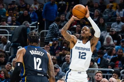 Jan 14, 2023; Indianapolis, Indiana, USA; Memphis Grizzlies guard Ja Morant (12) shoots the ball while Indiana Pacers forward Oshae Brissett (12) defends in the second half at Gainbridge Fieldhouse. Mandatory Credit: Trevor Ruszkowski-USA TODAY Sports