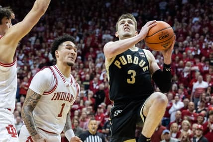 Feb 4, 2023; Bloomington, Indiana, USA; Purdue Boilermakers guard Braden Smith (3) shoots the ball while Indiana Hoosiers guard Jalen Hood-Schifino (1) defends in the second half at Simon Skjodt Assembly Hall. Mandatory Credit: Trevor Ruszkowski-USA TODAY Sports