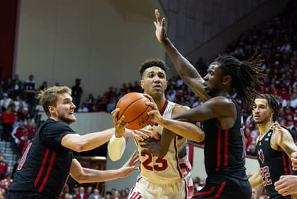 Feb 7, 2023; Bloomington, Indiana, USA; Indiana Hoosiers forward Trayce Jackson-Davis (23) shoots the ball while Rutgers Scarlet Knights guard Cam Spencer (10) and  center Clifford Omoruyi (11) defend in the first half  at Simon Skjodt Assembly Hall. Mandatory Credit: Trevor Ruszkowski-USA TODAY Sports
