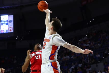 Feb 15, 2023; Gainesville, Florida, USA; Florida Gators blocks the shot of Mississippi Rebels forward Robert Allen (21) during the first half at Exactech Arena at the Stephen C. O'Connell Center. Mandatory Credit: Kim Klement-USA TODAY Sports
