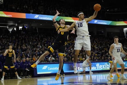 Feb 19, 2023; Evanston, Illinois, USA; Northwestern Wildcats forward Tydus Verhoeven (10) steals the ball from Iowa Hawkeyes forward Filip Rebraca (0) during the first half at Welsh-Ryan Arena. Mandatory Credit: David Banks-USA TODAY Sports