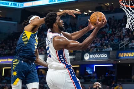 Mar 6, 2023; Indianapolis, Indiana, USA; Philadelphia 76ers center Joel Embiid (21) shoots the ball while Indiana Pacers forward Isaiah Jackson (22) defends in the second quarter at Gainbridge Fieldhouse. Mandatory Credit: Trevor Ruszkowski-USA TODAY Sports