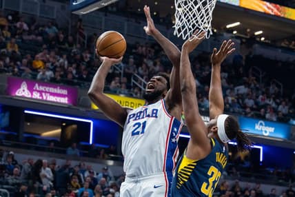 Mar 6, 2023; Indianapolis, Indiana, USA; Philadelphia 76ers center Joel Embiid (21) shoots the ball while Indiana Pacers center Myles Turner (33) defends in the second half at Gainbridge Fieldhouse. Mandatory Credit: Trevor Ruszkowski-USA TODAY Sports